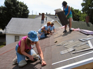 Habitat installing front shingles